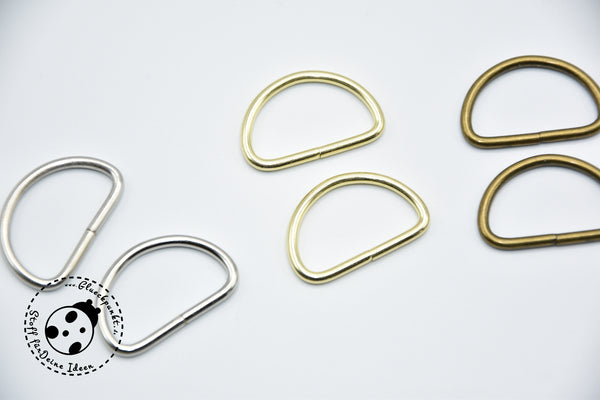 D-Ring-Set "Elegant" - 2 Stück. Der Halbring hat einen Durchmesser von ca. 25 mm und ist extra dick. An der Verbindungsstelle ist er nicht verschweißt. D-Ringe eignen sich besonders zum Befestigen von Gurten an Taschen oder Handtaschen, sowie für die Herstellung von Hundeleinen oder Schnullerbändern. Halbring, Dring, D Ring - Nähen/Basteln - Glückpunkt